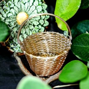 Brass basket with re-positional handle